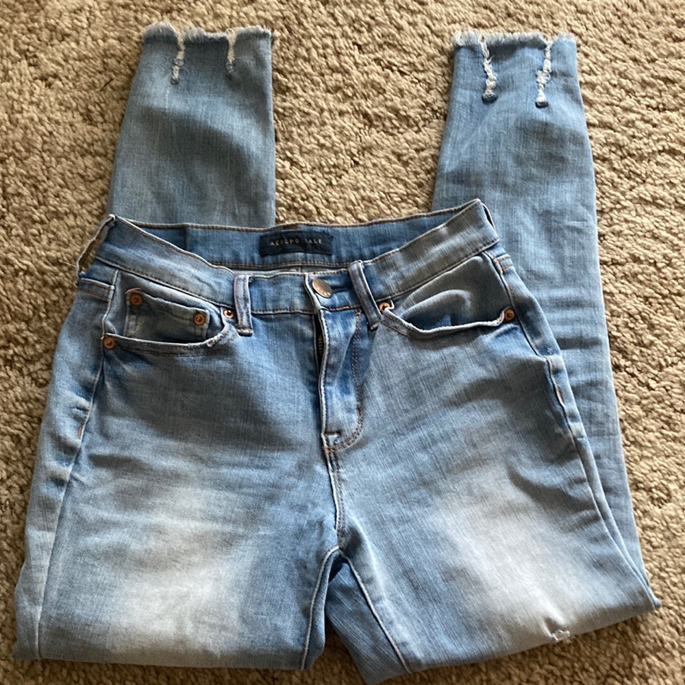 faded wash blue jeans ripped and skinny